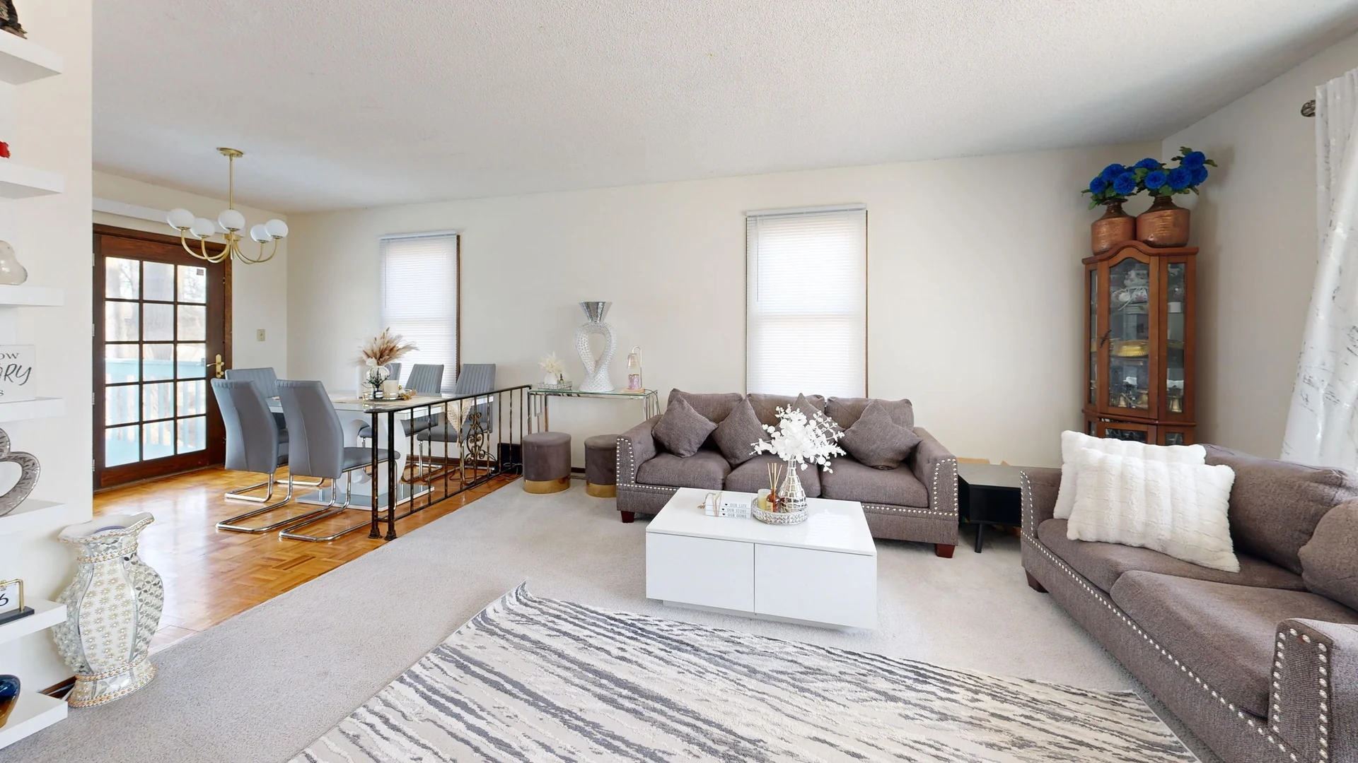 Bright modern living and dining room with stylish decor and natural light.
